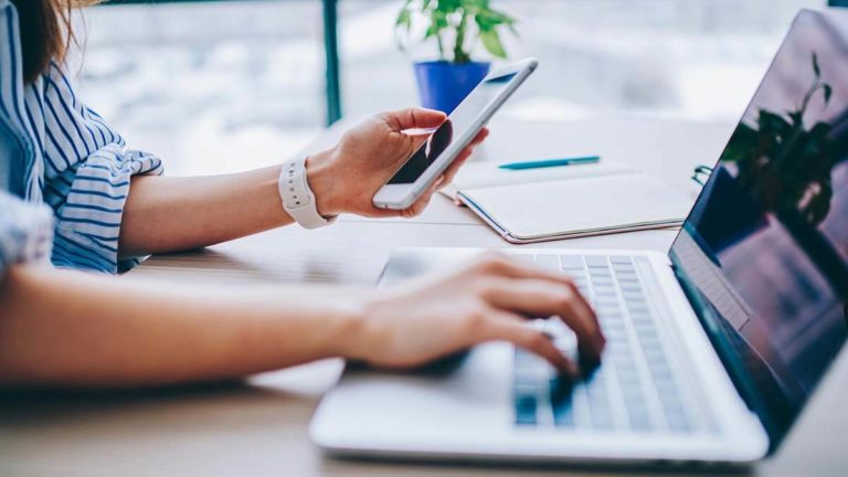 Woman filling out Form 1065 online.