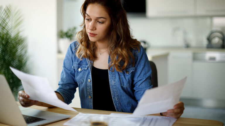 Woman looking at Form 941.