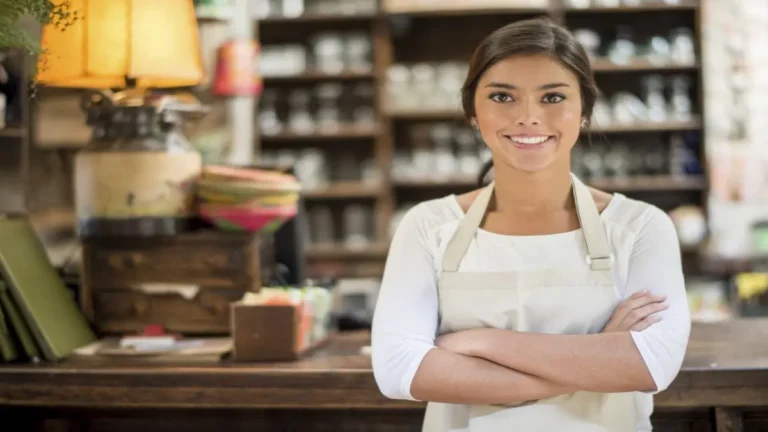Smiling shop owner
