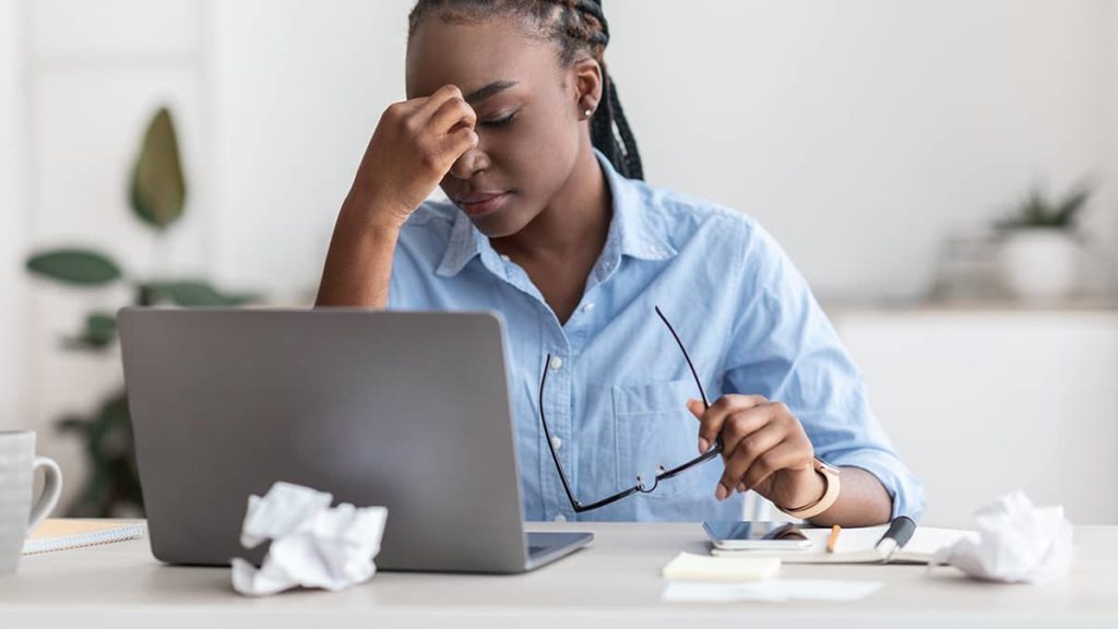 overwhelmed woman wondering what is my state unemployment tax rate