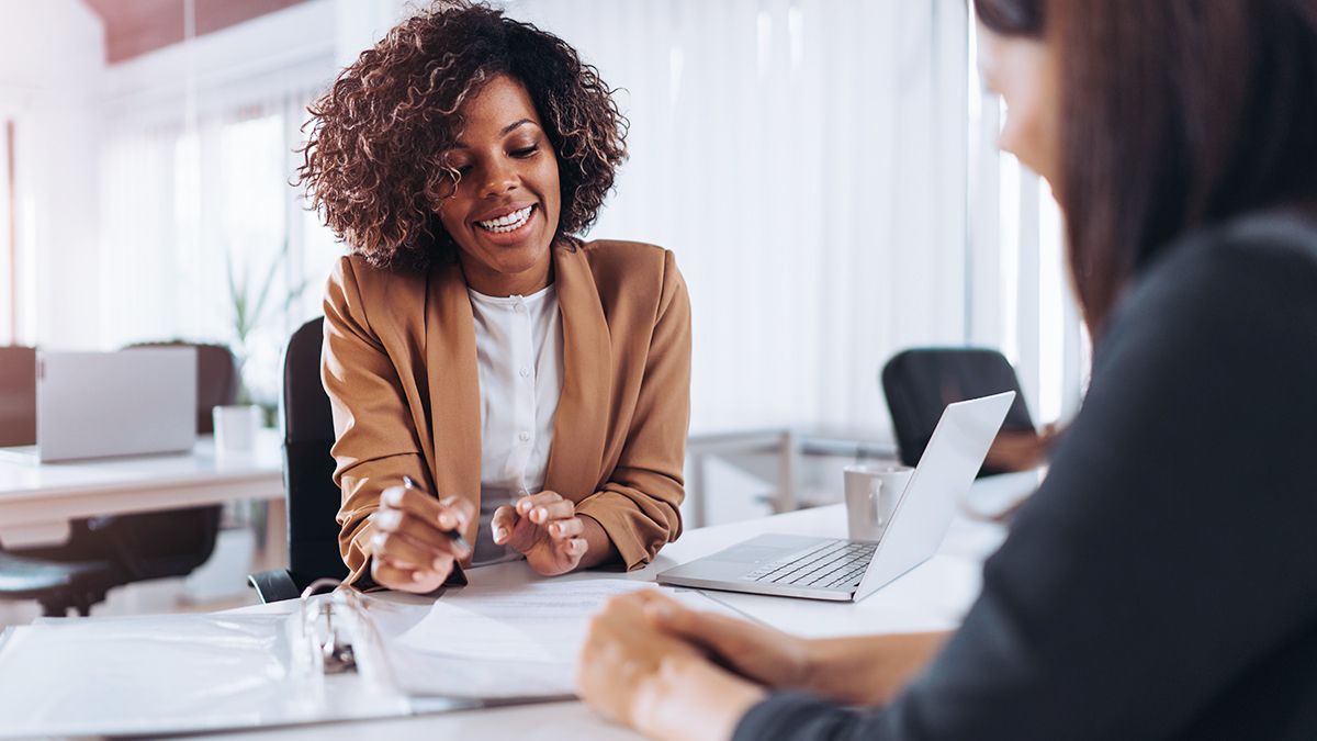 woman reviewing paperwork on a desk