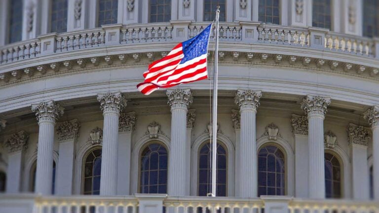 American flag in front of a government building.