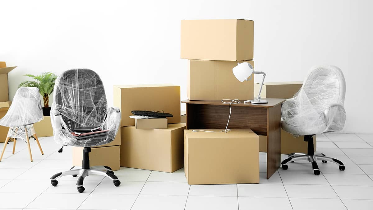 boxes and wrapped chairs during a business change of address