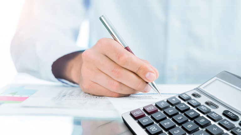 Business owner filling out Form 1120X, Amended Return.