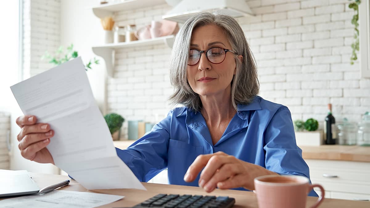 Woman looking at her small business tax refund.