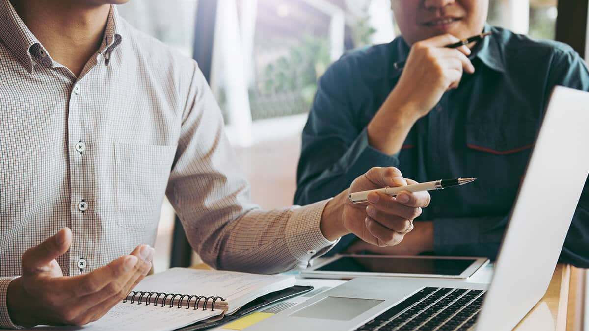 Two co-workers using accounting information for decision-making.