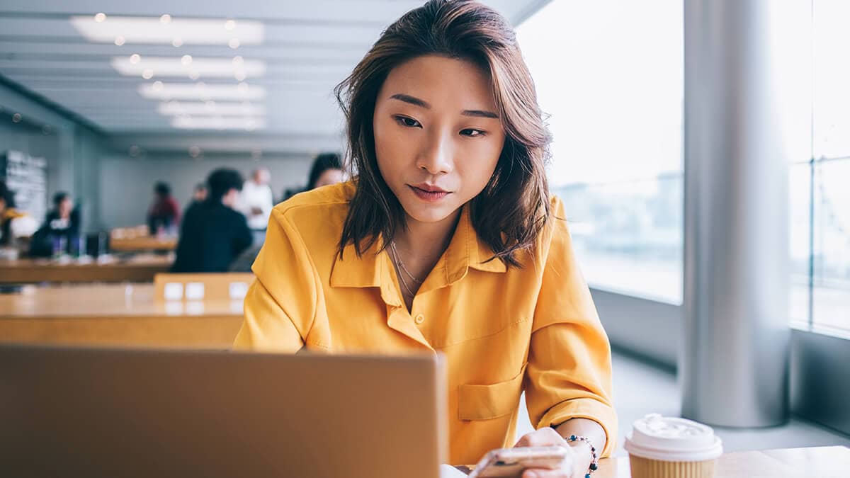 Woman using a laptop.