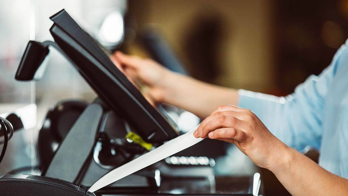 Cashier recording a transaction.