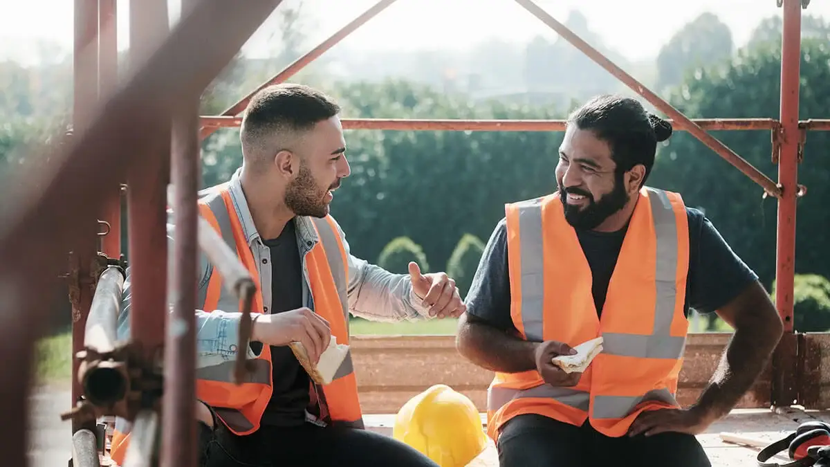 Two construction works on a rest and meal break