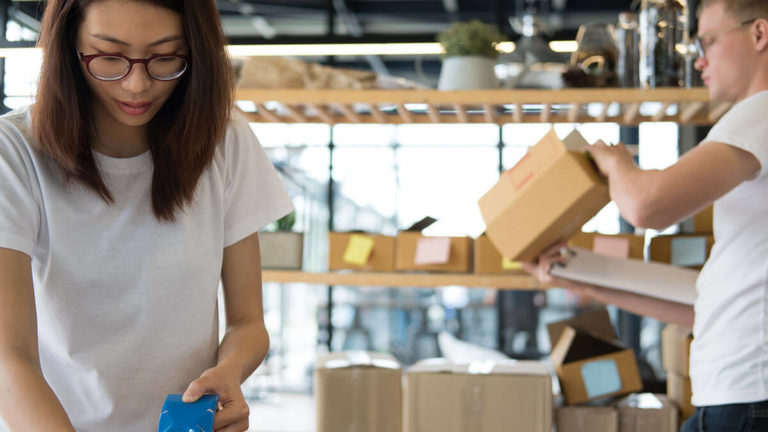 Employees handling shipping for small business.