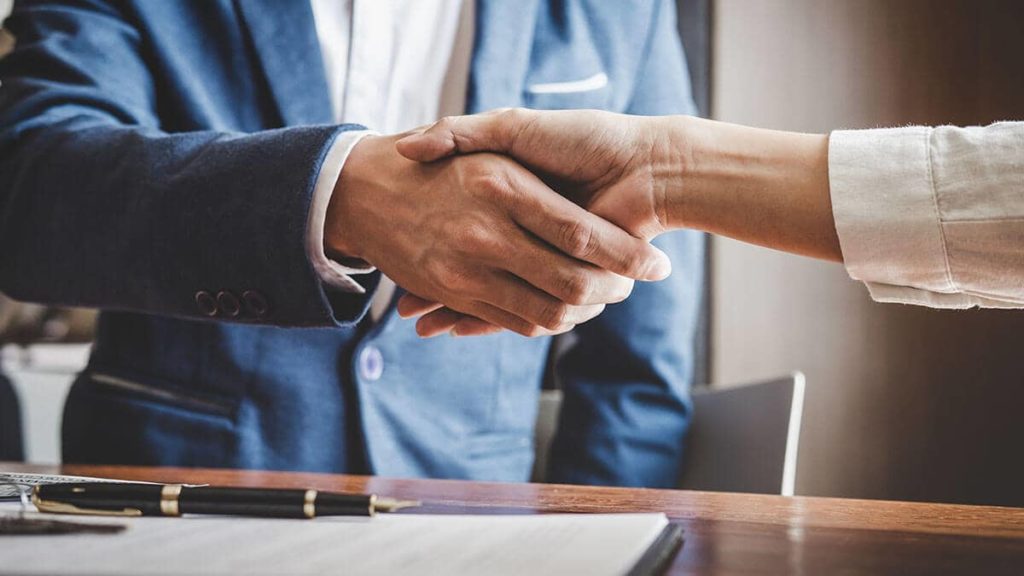 Two people shaking hands.