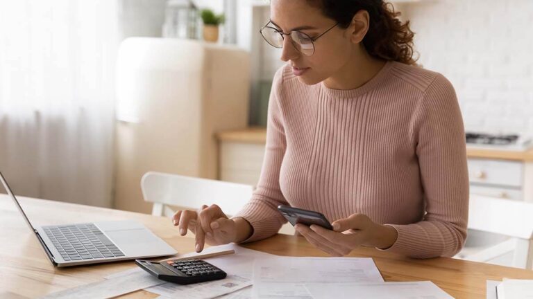 Woman using a calculator.