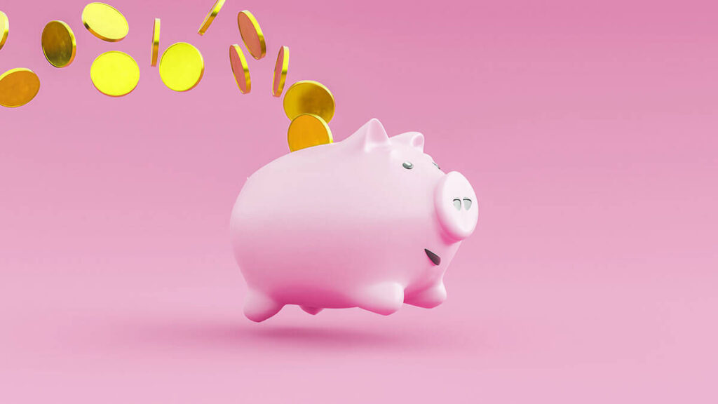 Piggy bank with coins flying behind it