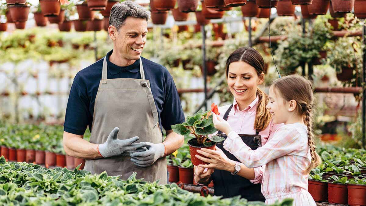 A family in a greenhouse.