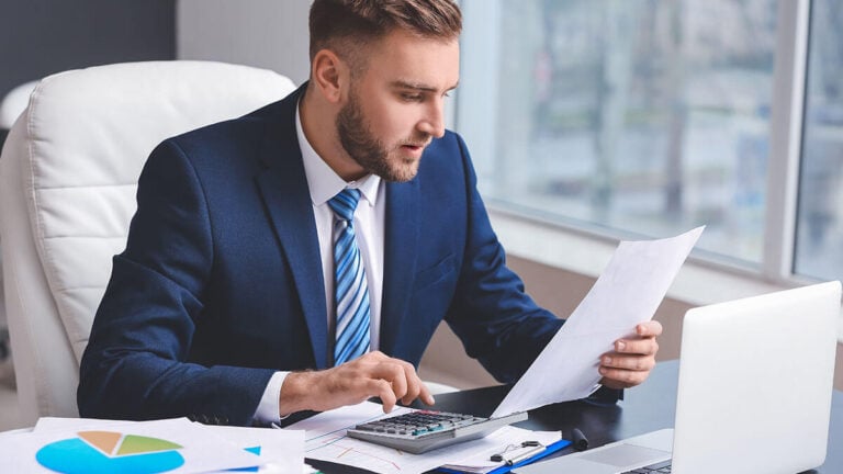 Accountant reading a piece of paper