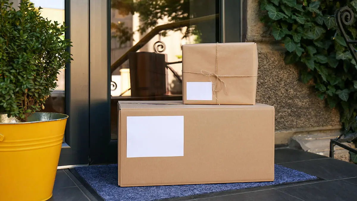Two boxes stacked in front of door