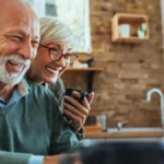 Older couple happily reviewing retirement plans.