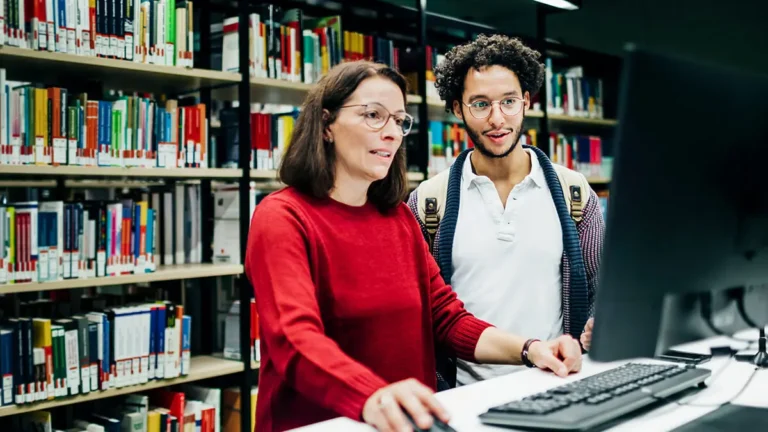 Employees reviewing education assistance
