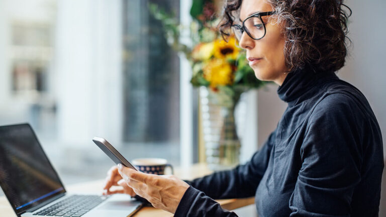 Woman looking at her cell phone.