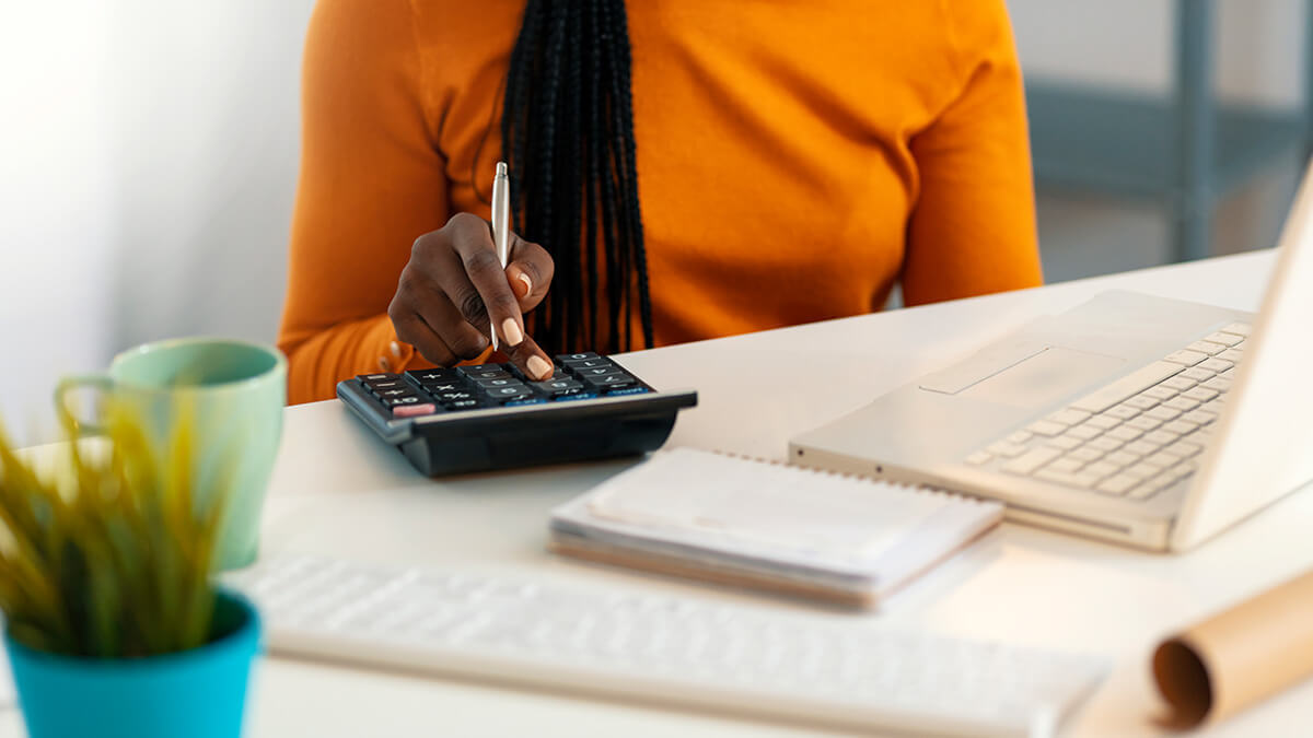 Woman using a calculator.