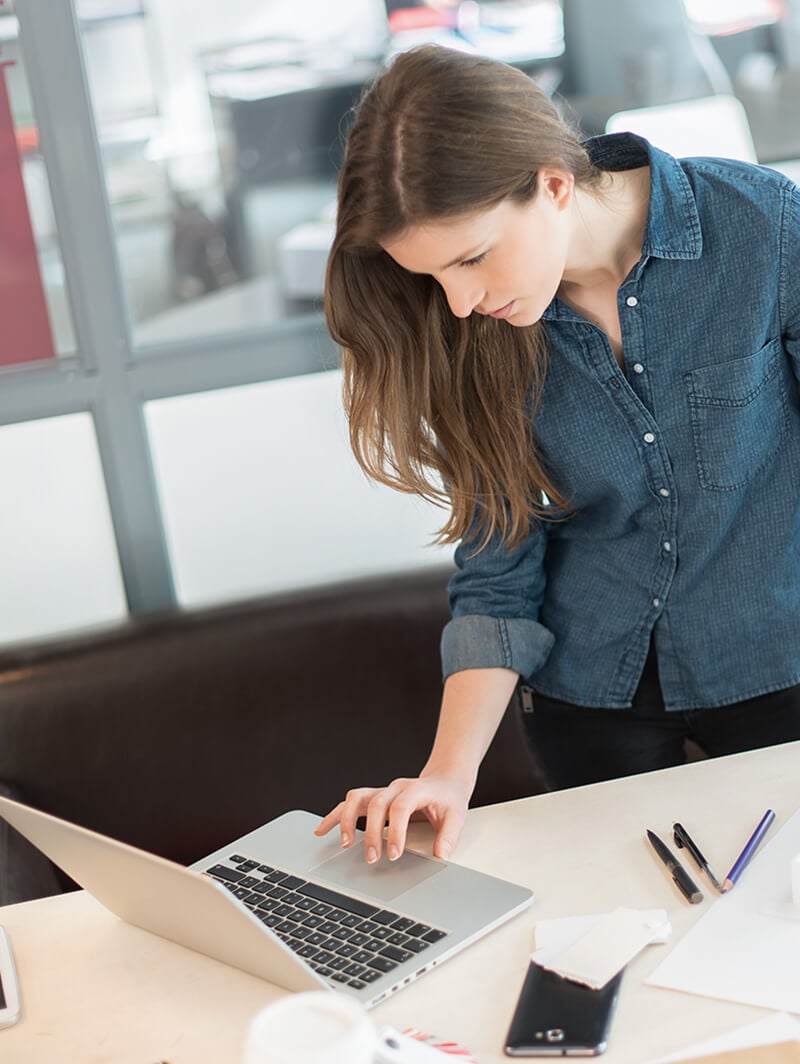 Woman using laptop to research
