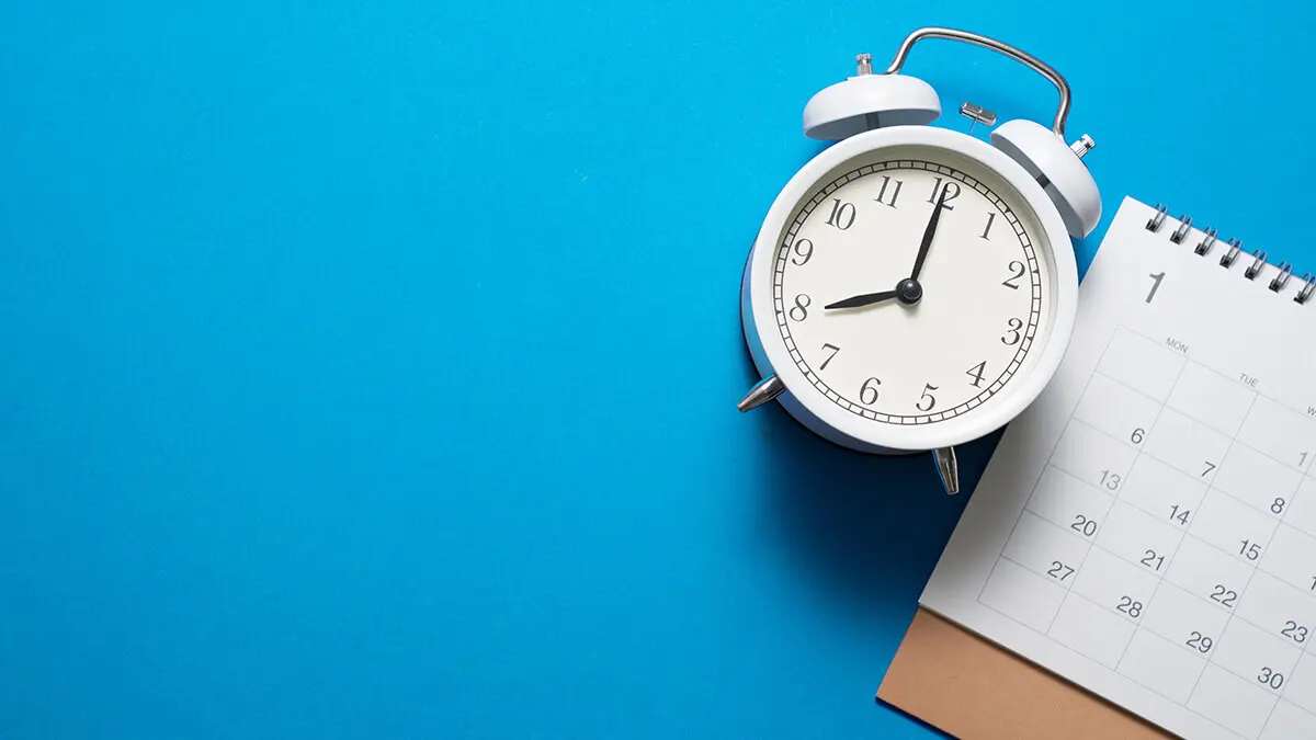 Clock and calendar on blue background