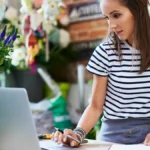 Self-employed woman using a computer.
