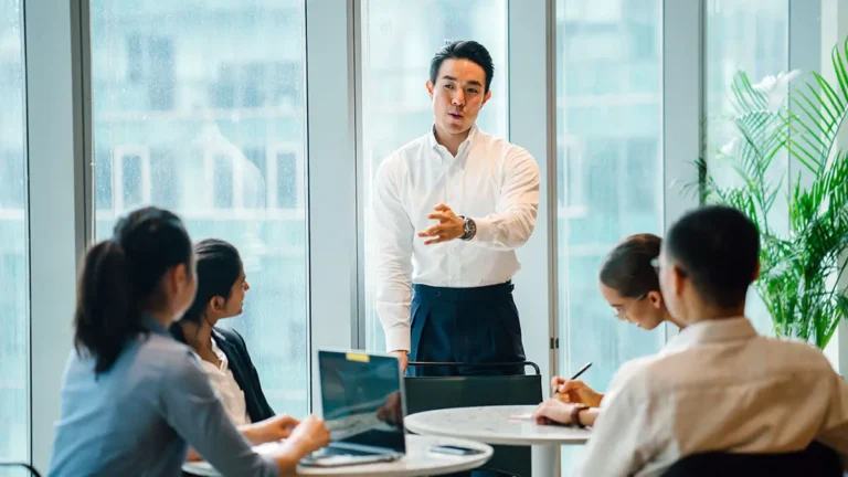 Business meeting explaining what is escrow