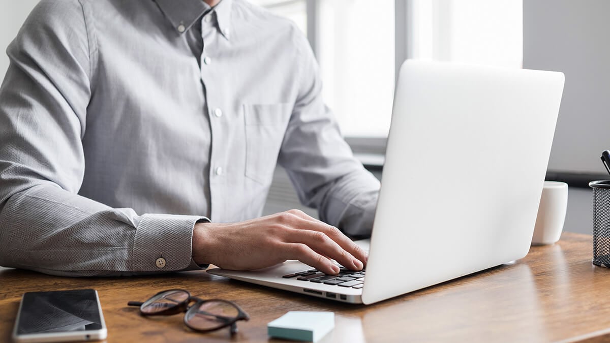 Man using a laptop.