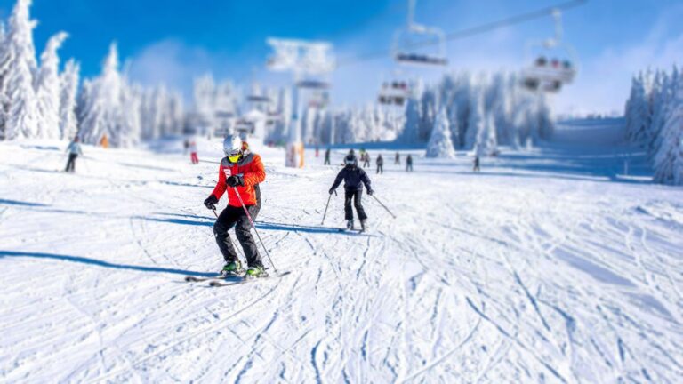 Two people skiing at a seasonal business.