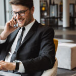Accountant on the phone and using a computer.
