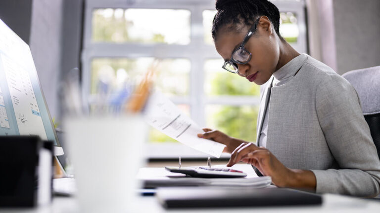 Woman reviewing a credit memo.