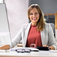 Smiling woman in Patriot's partner program.