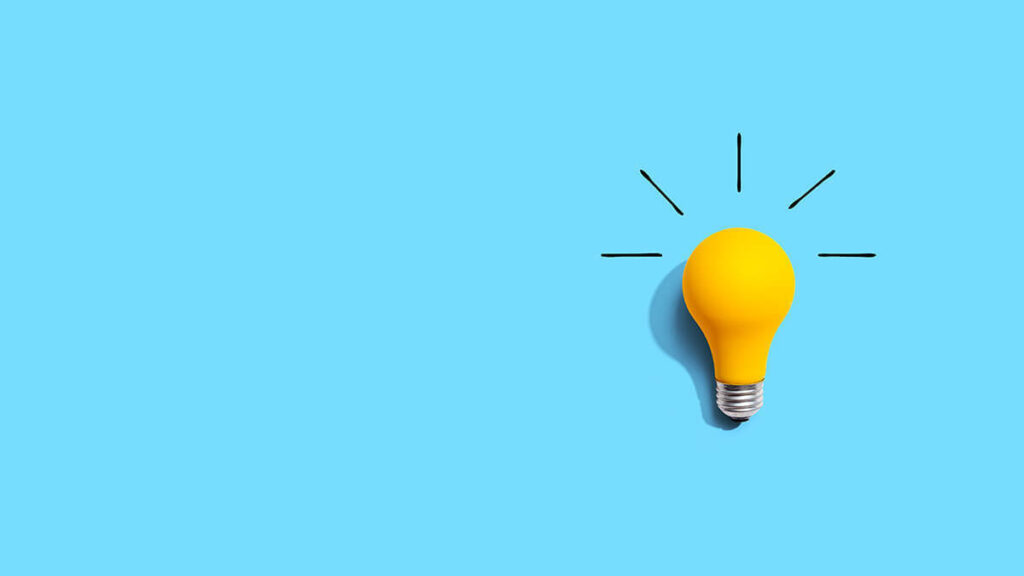 Yellow lightbulb on a blue background.