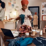 Small business employees working in a clothing design company
