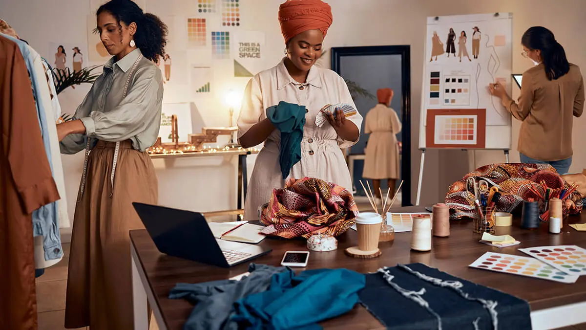 Small business employees working in a clothing design company