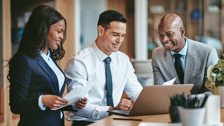 Three accountants figuring out how to get clients to pay on time.