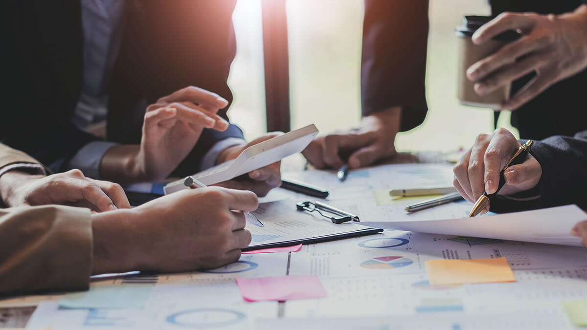 Employees preparing accounting estimates.