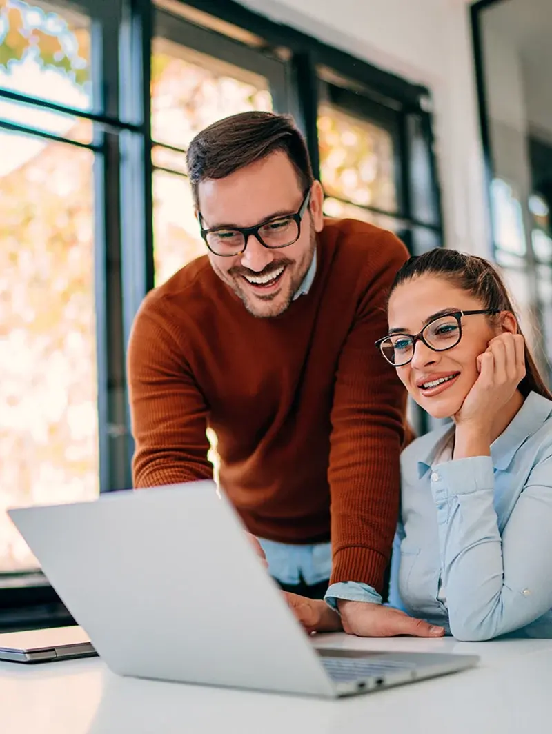 Man and woman looking at laptop