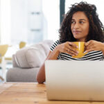 Accountant holding a cup of coffee staring in the distance