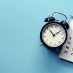 clock and calendar on a blue background