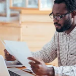Man reviewing self-employment tax deductions