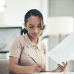 Business owner filing her taxes using small business tax tips