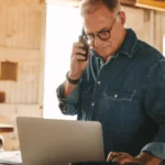 sole proprietors on the phone while using accounting software