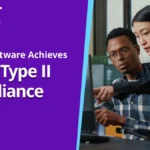 two people looking at computer reading about soc 2 type II compliance