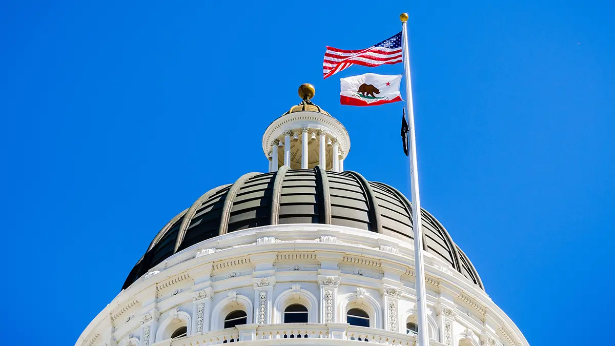 Government building flying the American and California flags.