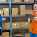Two workers learning how long to keep business records.