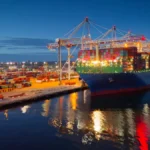 Boat carrying shipment of goods for import.