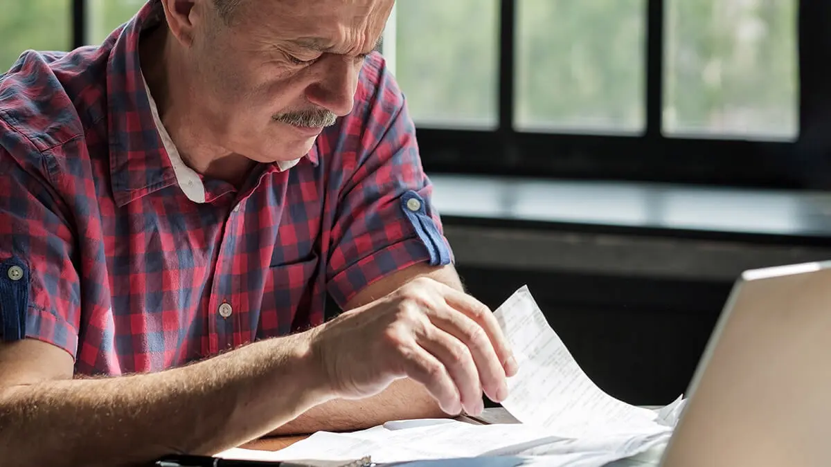 Man learning how to contact the IRS.