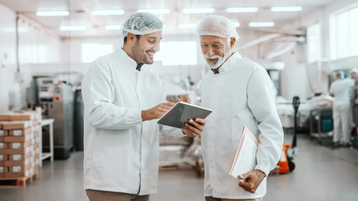 Two food workers reviewing the R&D tax credit.